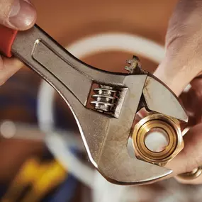 Up close wrench tightening a pipe