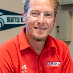 A Bulldog Rooter Technician smiling at the camera