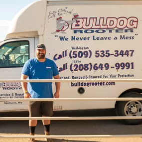 Bulldog Rooter technician standing in front of the work truck