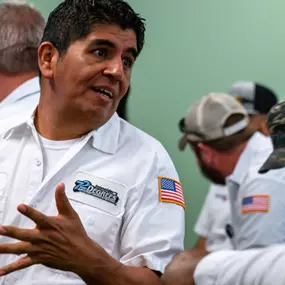 A 72 Degrees Texas employee at a team meeting