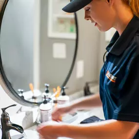 A Radiant San Antonio employee testing the bathroom faucet