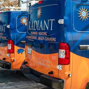 A photo of the Radiant Plumbing and Air Conditioning fleet of trucks