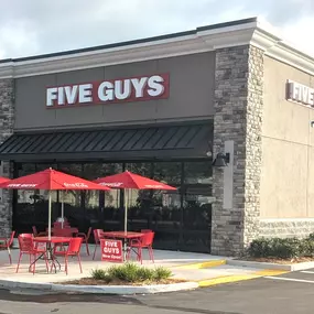 Exterior photograph of the Five Guys restaurant at 8124 Little Road in New Port Richey, Florida.