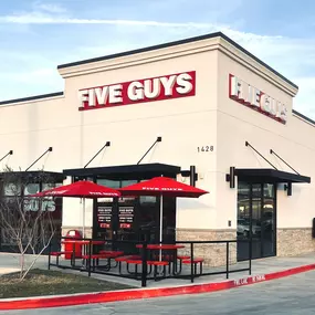 Exterior photograph of the Five Guys restaurant at 1428 North Old Decatur Road in Saginaw, Texas.