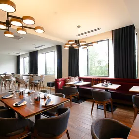 Main dining room with large windows for natural lighting