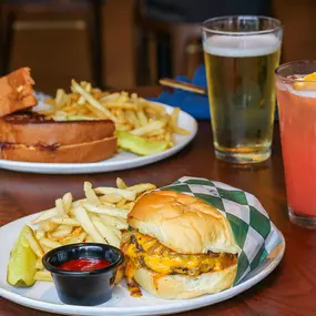 Steak burger with fries and cocktail