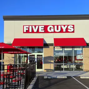 Exterior photograph of the Five Guys restaurant at 23992 US Highway 80 East in Statesboro, Georgia.