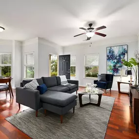 a living room with a couch and a ceiling fan at Sovereign at Overland Park, Overland Park, 66213