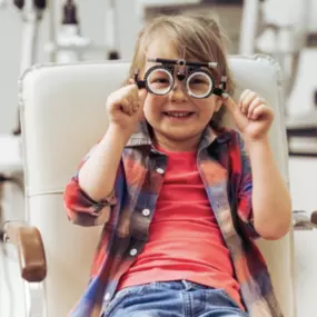 kid getting his eyes treated at the eye doctors office