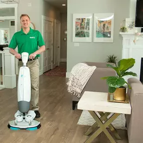 chem-dry technician refinishing hardwood floor