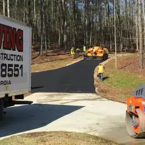 PKS Paving truck parked in front of a newly paved road