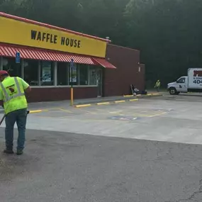 PKS Paving employees working on a Waffle House Parking lot