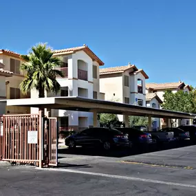 A row of houses with a gate in front