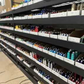 ASN's own embroidery thread rack. Come and choose your next color with us today.