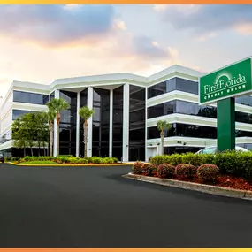 First Florida Credit Union's Southpoint branch is a black and white building with a green sign out front featuring the credit union's logo.