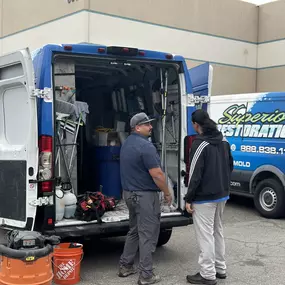 Superior Restoration Crew Members Talking to One Another