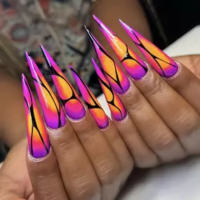 Bold triple ombre neon nails blending vibrant colors for a striking look.