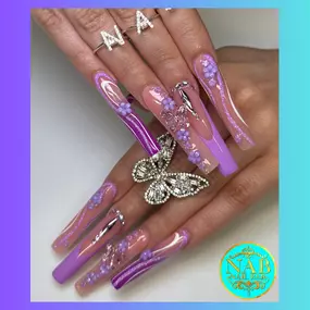 Glamorous deep French lavender nails with sparkling rhinestone accents.