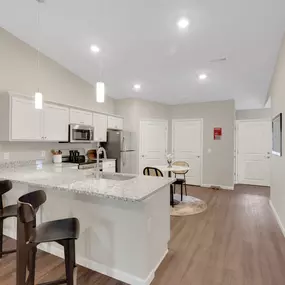 Granite Counters with Stainless Steel Fixtures and Appliances