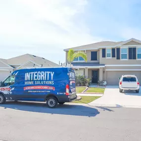 Integrity Home Solutions work van outside of the house