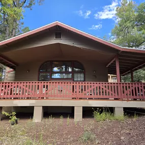 Cabin #15 is the Honeymoon Suite at Northwoods Cabins, with large windows giving you a beautiful view of the forest and a spa tub to be able to enjoy a romantic vacation.