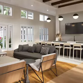 Living room with a couch and a table with chairs
