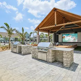 Outdoor kitchen with grilling stations