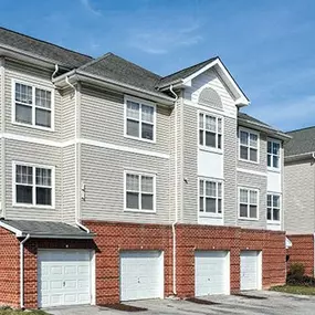 a row of town houses with garage doors