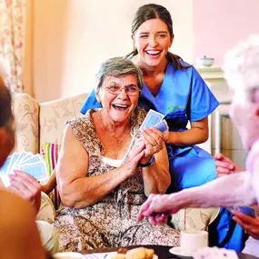 Cropped shot of seniors playing cards in their retirement home