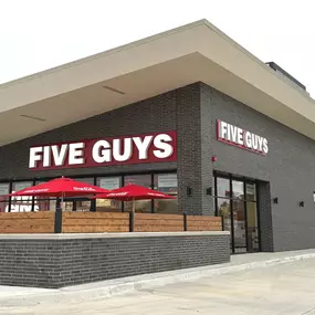 Exterior photograph of the Five Guys restaurant at 5201 North May Avenue in Oklahoma City, Oklahoma.