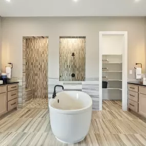 Luxurious primary bathrooms with walk-in showers and soaking tubs