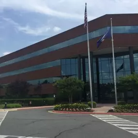 Front entrance of our Fredericksburg VA insurance agency office large brick and glass building