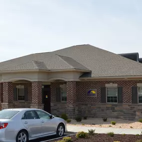 Front entrance of our Staunton VA insurance agency office one story red brick building