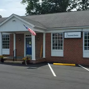 Front entrance of our Reidsville NC insurance agency office one story red brick building