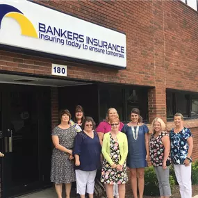 Employees standing in front of our Wytheville VA insurance agency office two story red brick building