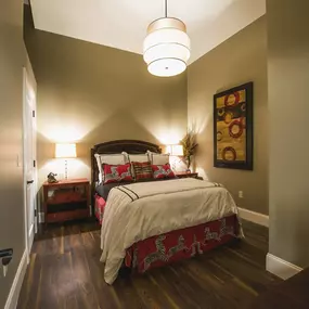 a bedroom with a bed and two nightstands at The Knights @ 506 Delaware Apartments, New York
