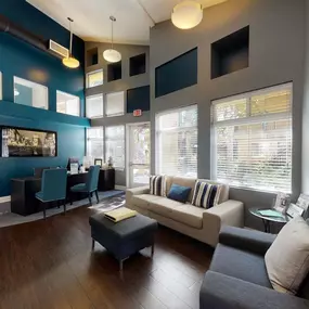 a living room with blue walls and a couch