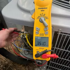 Multimeter testing a unit