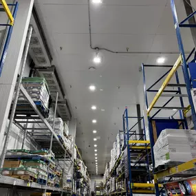 High-quality industrial lighting installation in a spacious warehouse. Designed for durability and efficiency, our electrical services enhance safety and visibility for large-scale operations.