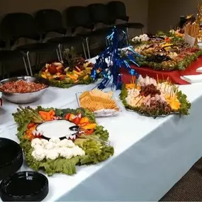 A full catering setup with various entrees, salads, and sides by Cranberry Hills Eatery & Catering is designed for events and celebrations in Phoenix, AZ.