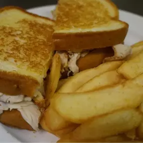 A grilled cheese sandwich with golden fries is a comforting lunch option at Cranberry Hills Eatery & Catering in Phoenix, AZ.