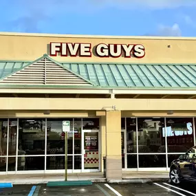 Exterior photograph of the Five Guys restaurant at 8741 Southwest 136th Street in Miami, Florida.