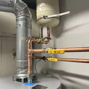 We installed new 50 gallon gas water heater with new expansion tank. We also intalled new 1/4 turn ball valves.