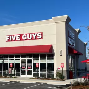 Exterior photograph of the Five Guys restaurant at 1838 N. Lecanto Highway in Lecanto, Florida.