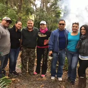 Cleaning debris of an elderly man from a hurricane.  Teaming with Meals on Wheels Seminole & The Hispanic Chamber of Commerce of Metro Orlando