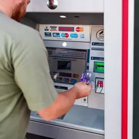 Customer using Post Office ATM