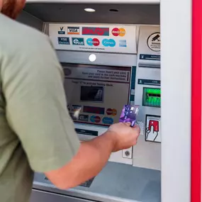 Customer using Post Office ATM