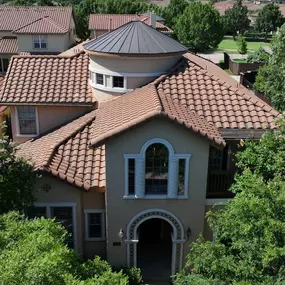 Front view of house with clay tile roof