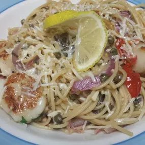 Shrimp and Scallops with mixed veggies over spaghetti tossed in a white-wine-garlic-butter sauce.