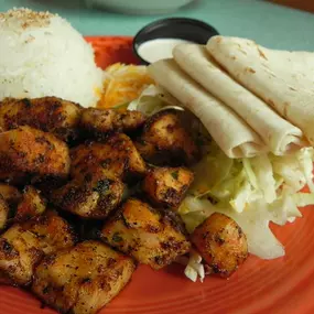 Mama’s World Famous Fish Tacos - Fresh Mahi Mahi marinated and sautéed. Served with cheddar/jack cheese, scallions, jasmine rice, shredded cabbage, flour tortillas and our lime sour cream to top them with.